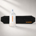 Banano essential color negro con detalle naranjo, vista frontal junto con botella soft flask wave 250 ml