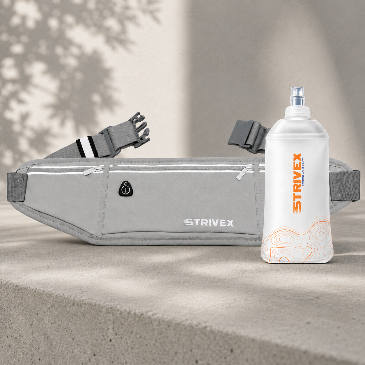 banano running gris respirable junto con botella soft flask wave 250 ml